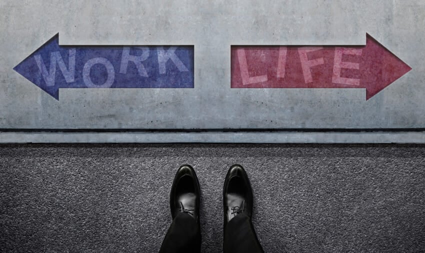 Work-life-balance-concept-an-undecided-businessman-standing-in-front-of-the-left-and-right-arrow-direction.jpg