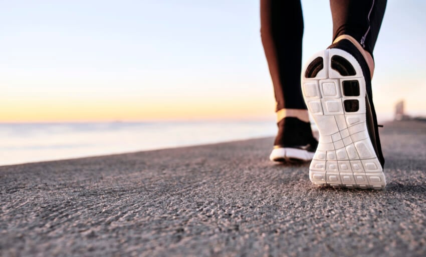Closeup-of-sport-shoes-on-concrete-path.jpg