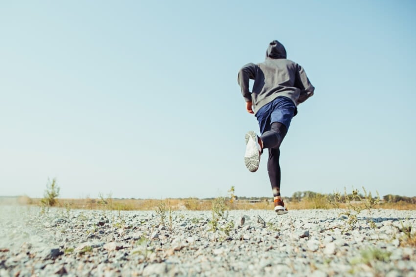 Running-sport-man-runner-sprinting-outdoor-in-scenic-nature-fit-muscular-male-athlete-training-trail-running-for-marathon-run-sporty-fit-athletic-man-working-out-in-compression-clothing-in-sprint.jpg