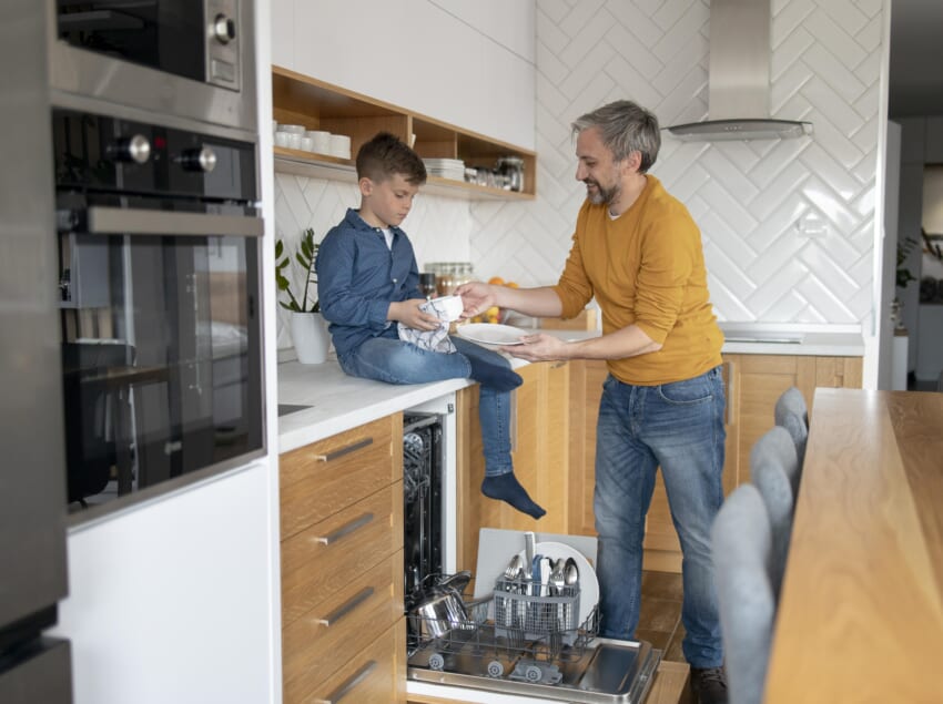 Full-shot-man-and-kid-cleaning-dishes.jpg