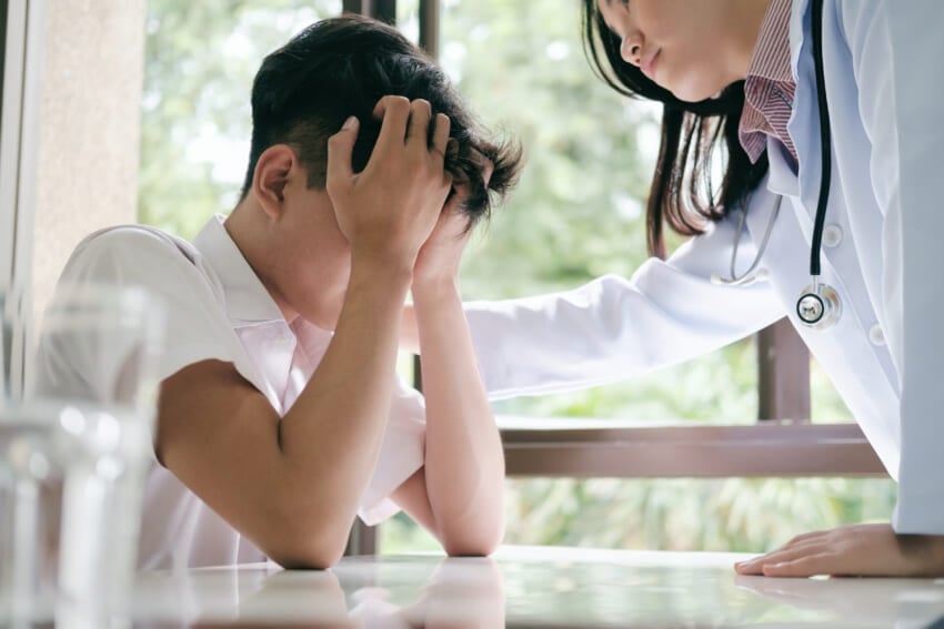 Female-doctor-consoling-sad-patient-clinic.jpg